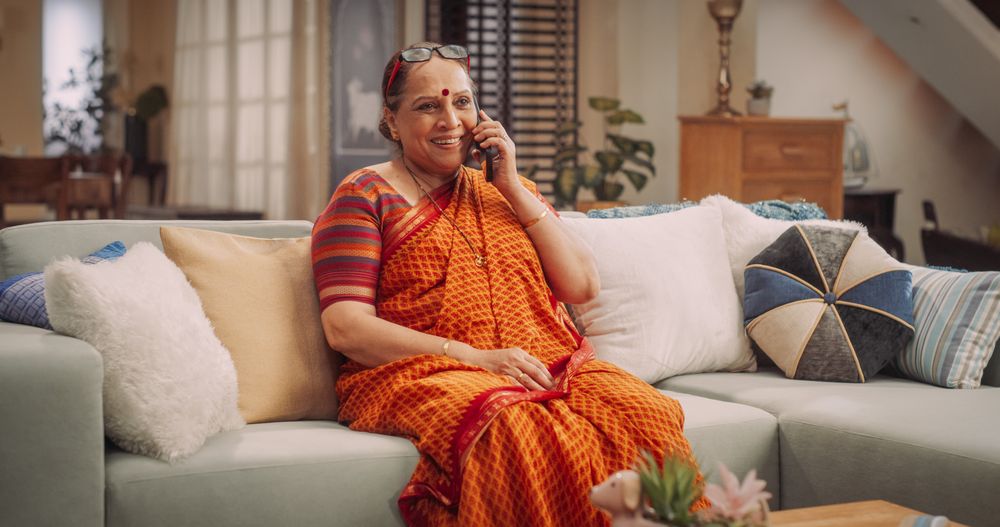 Older Indian Woman Using Smartphone at Home: Talking with Loved Ones, Relatives, Friends, Grandchildren