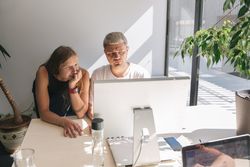 People working in sunny modern office
