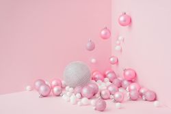 Baubles in a variety of pink shades in corner of pink room