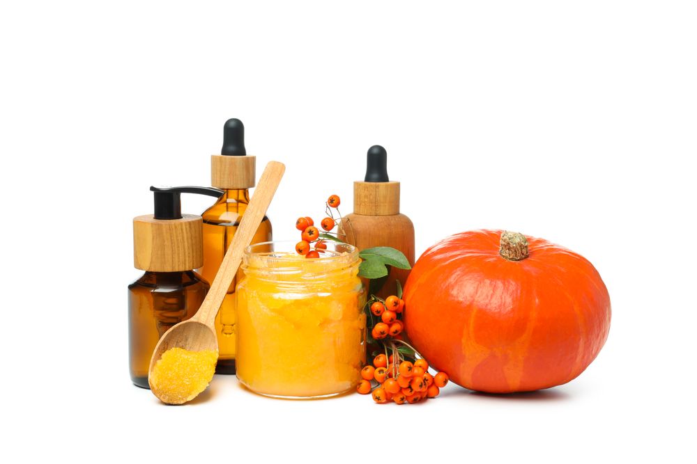 Concept of different cosmetic products, Pumpkin cosmetics, isolated on light background
