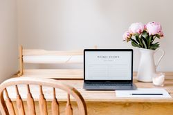 Displaying Laptop and Flowers on Table