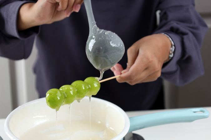 Female Hand Coating Shine Muscat with Sugar Glaze