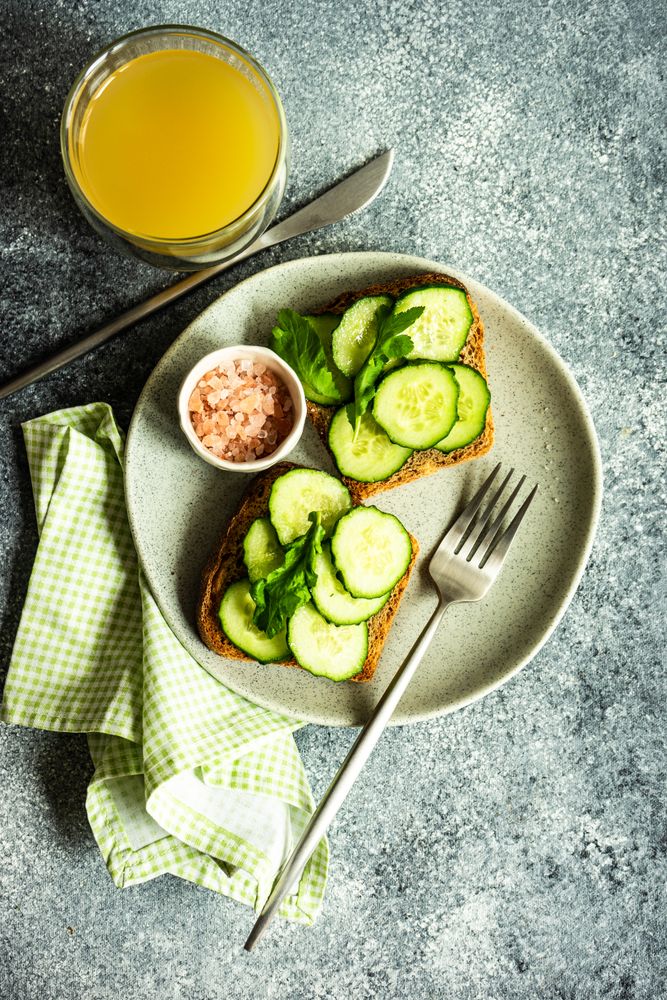 Top view of healthy lunch with vegetable cucumber toast