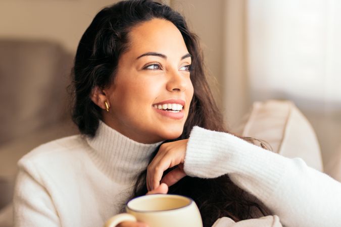 Enjoying Morning at Home: Young Woman Drinking Coffee