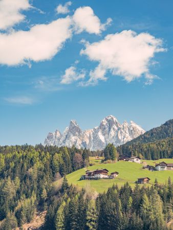 Small beautiful village between mountains with snow