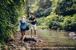Couple in forest by the stream 4Ox87b