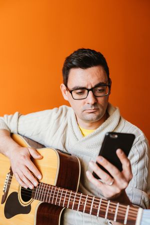 Musician looking at the mobile