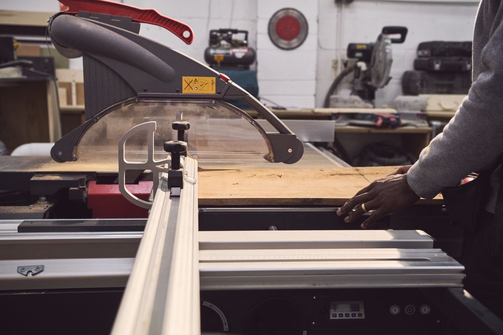 Man cutting wood with a carving machine