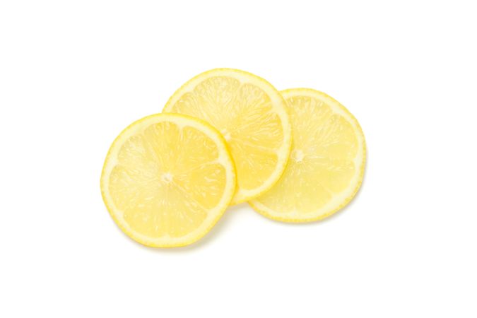 Lemons slices isolated on light background. Ripe fruit
