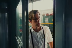Traveler looking out train window
