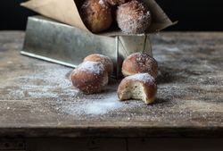 Baked cakes in craft paper on table