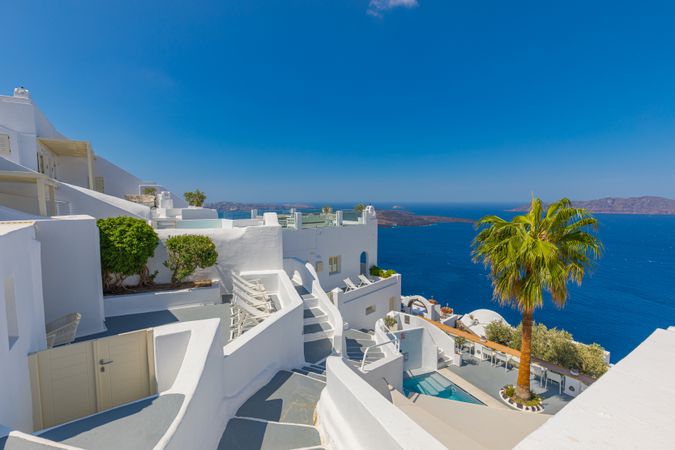 Interconnecting holiday villas in Santorini with view of the sea