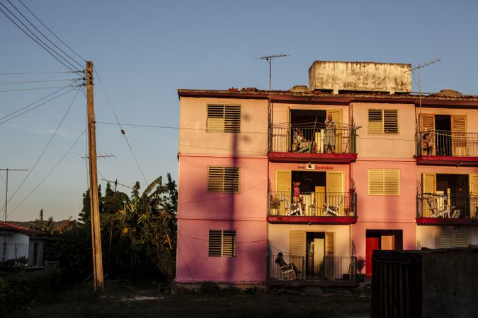 Residential pink building in a humble neighborhood
