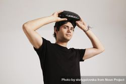 Man looking at camera removing VR headset 5krK30