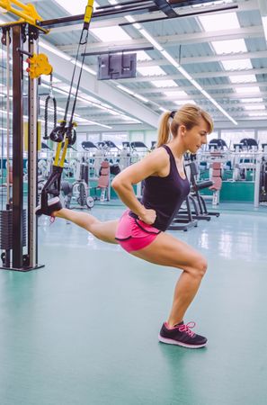 Woman doing lunges with elevated leg