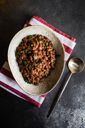 Top view of elegant ceramic bowl full of hearty bean dish