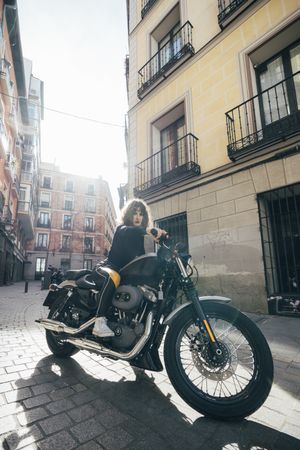 Young woman in custom motorbike