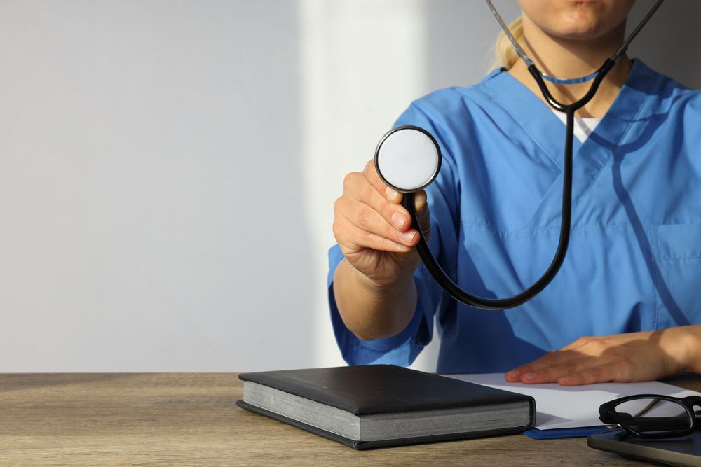 A stethoscope in the hands of a doctor
