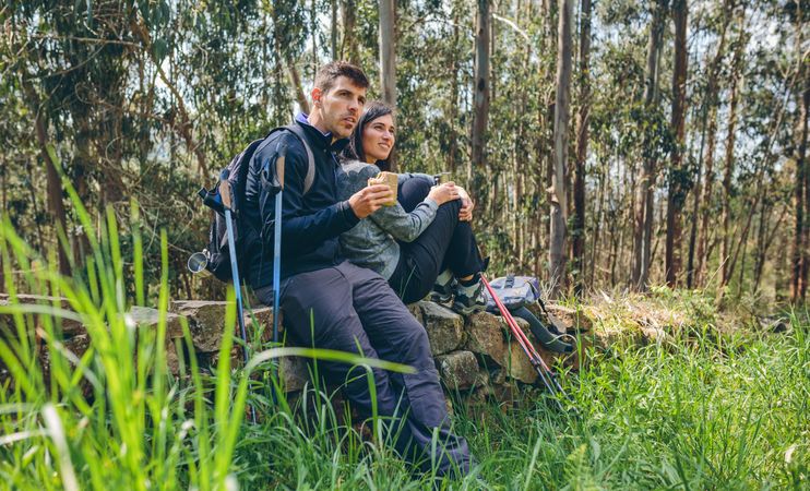 Couple pausing while doing trekking