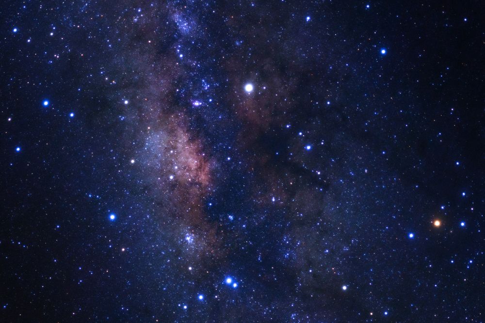 Milky way galaxy with stars and space dust in the universe, Long exposure photograph, with grain.