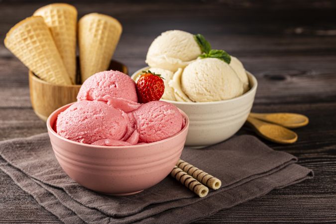 Bowls with strawberry and vanilla ice cream.