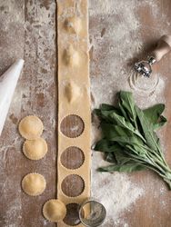 Sorrel and kitchenware near raviolis
