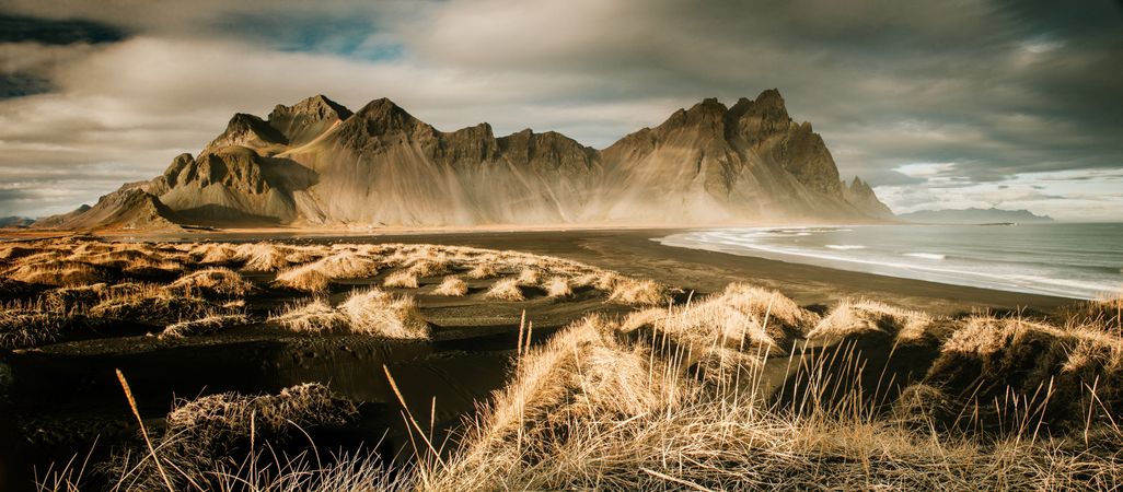 Panorama of grand cliff above water