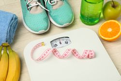 Healthy lifestyle accessories on neutral background, space for text