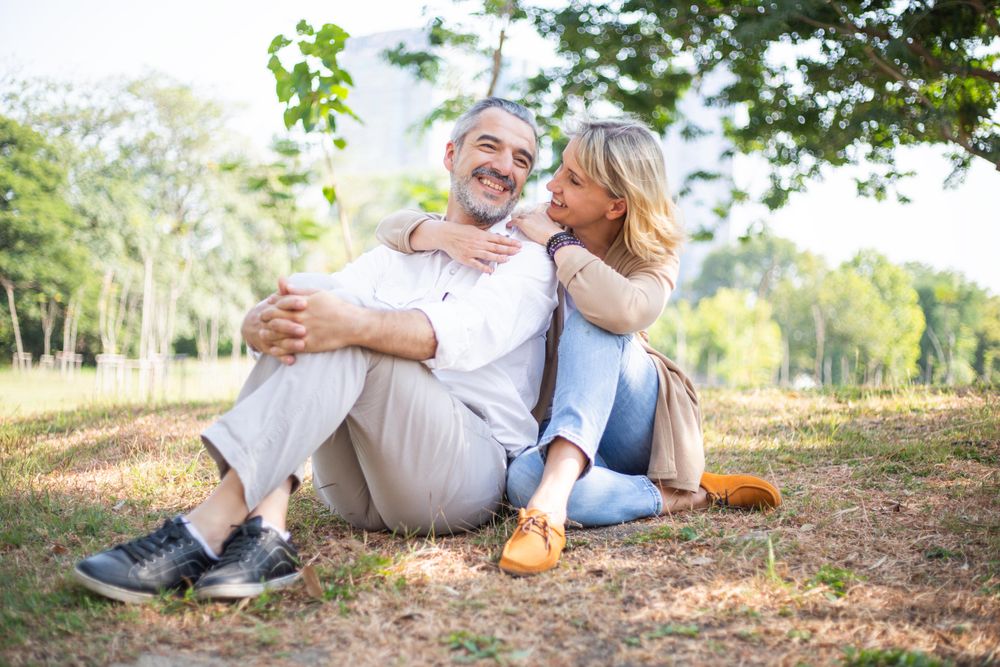 Woman with her arms around her partners shoulder