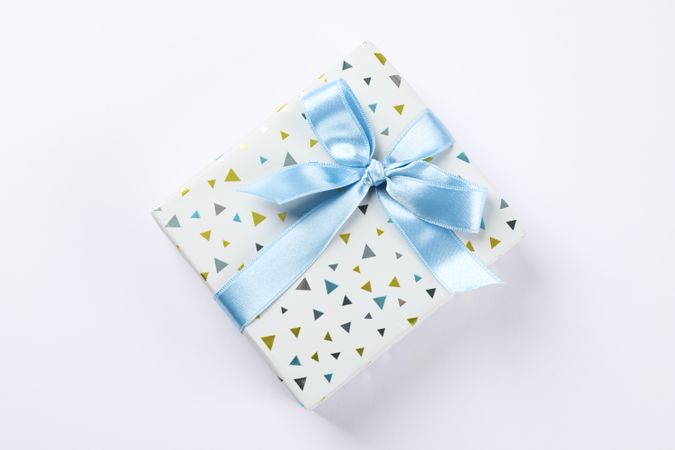 Beautiful gift box with bow on blank background, space for text