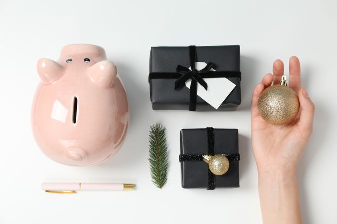 Concept of Christmas finance with piggy bank, top view