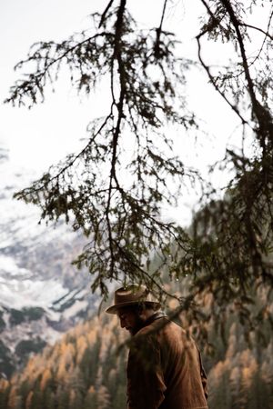 Man delighting in views of forest and mountains