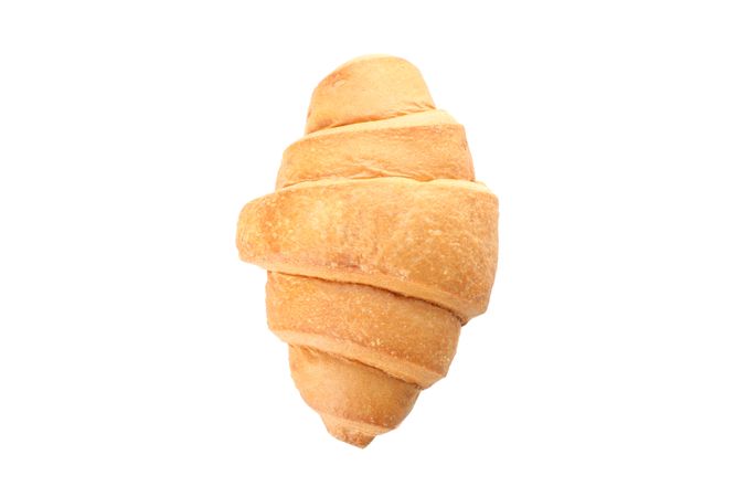 Looking down at freshly baked croissant on plain background