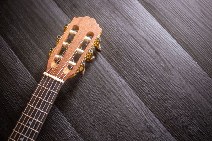 Ukulele on wooden tabletop