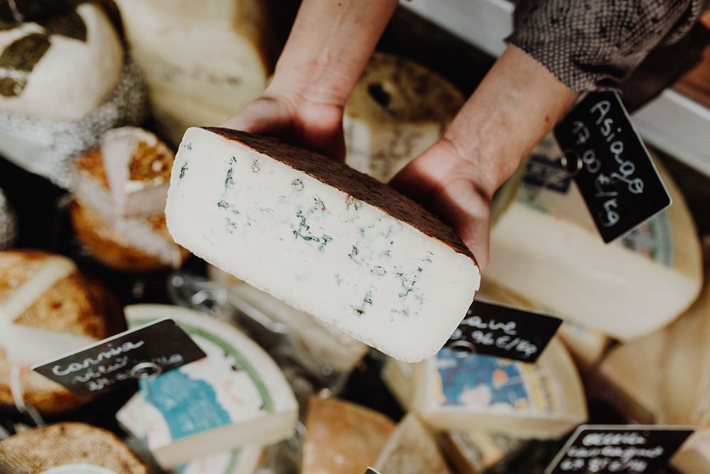 Person holding cheese