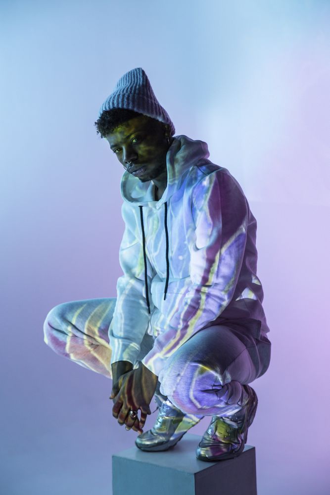 Stylish Black man on cube