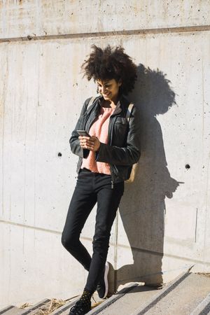 Black woman walking down the street.
