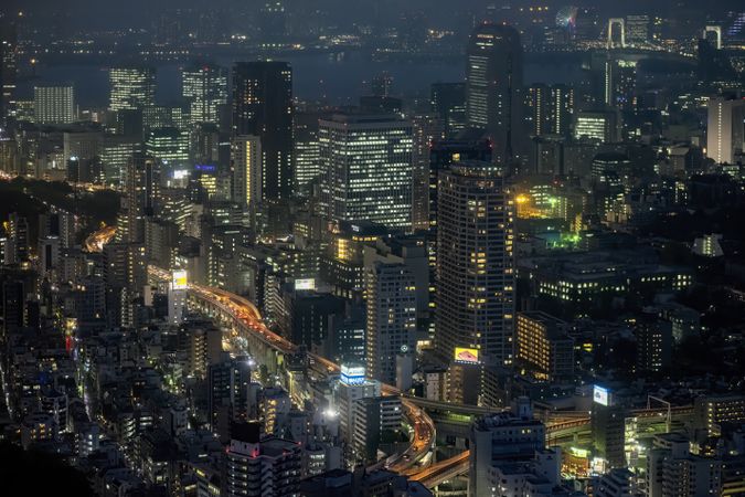 Aerial view of city buildings at night