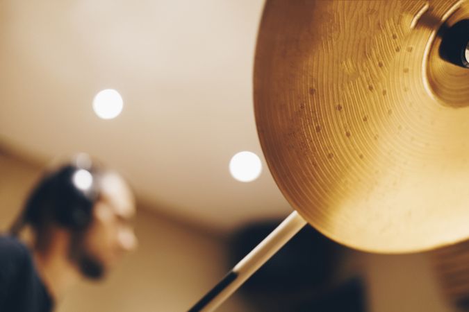 Man with headphones playing on drums