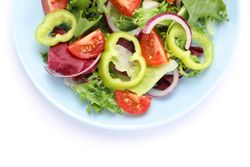 Salad of fresh vegetables isolated on blank background, top view