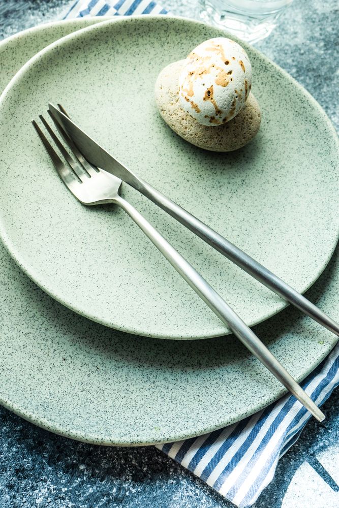 Coastal table setting with sea stars and shells