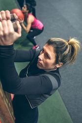 Woman hanging on the pegboard