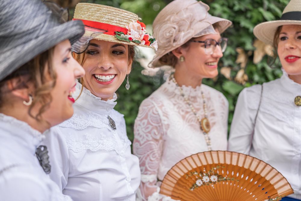 Vintage female friends speaking in garden