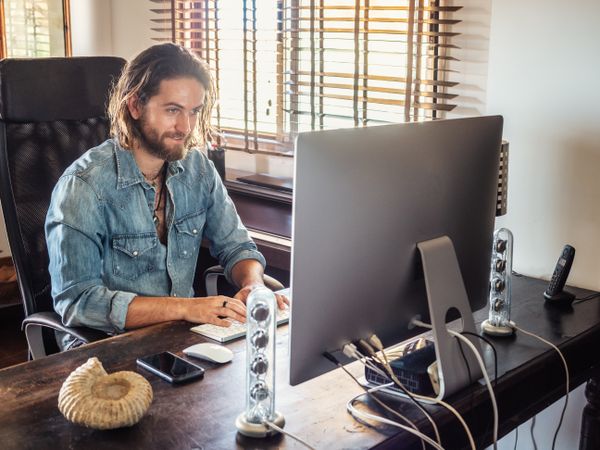 Man using computer in apartment