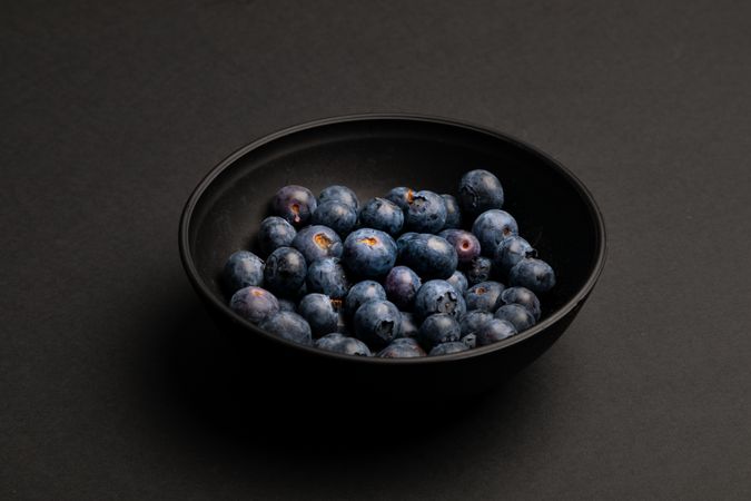 Bowl with ripe blueberries