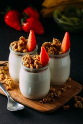 Glass bottles with milk and walnuts