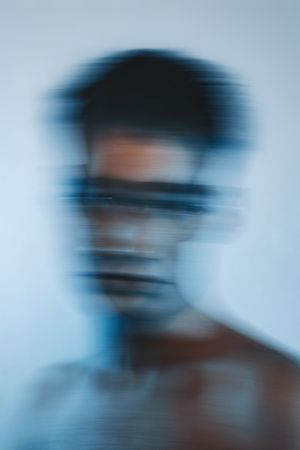 Blurry portrait of topless young man