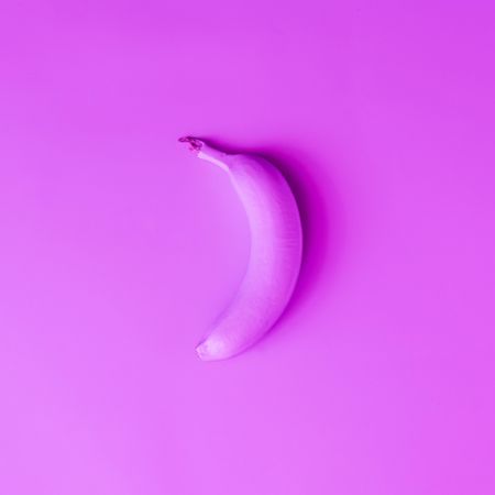 Banana in vibrant purple holographic color
