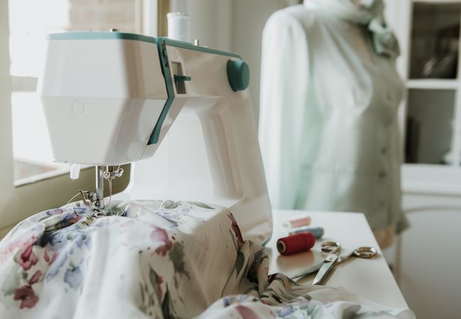Dummy with blouse near sewing machine