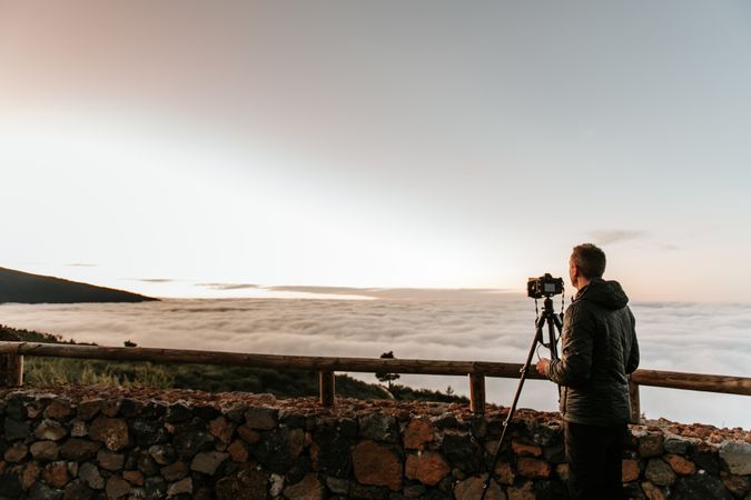 Photographer taking shot of hill view